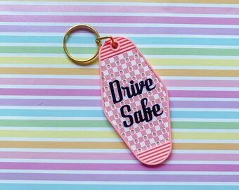 Drive Safe Pink Chequered Strawberry Motel Retro Keychain