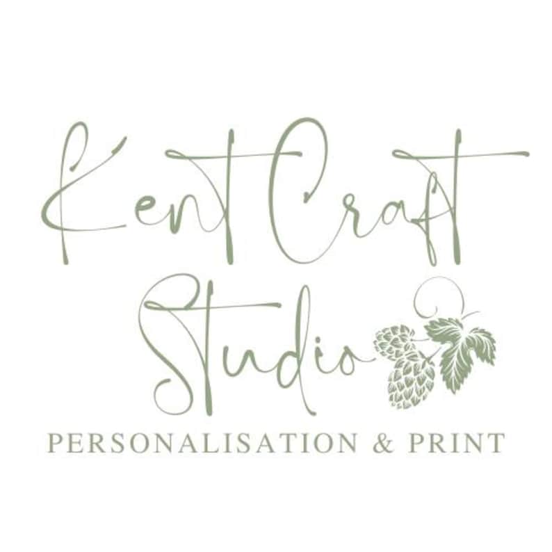 May include: Kent Craft Studio logo with the text "Kent Craft Studio" in a cursive font and the text "Personalisation & Print" below. The logo features a green stylized hop leaf and hop cones.