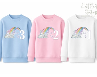 Personalised Children’s Birthday Sweatshirt – Custom Name Kids Jumper – Rainbow Design – Blue, Pink or White