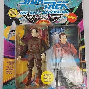 May include: A Star Trek: The Next Generation Lore action figure in its original packaging. The figure is brown and tan, with a matching image on the card. The packaging includes the text "Space The Final Frontier" and "Exclusive Skybox Playmates Collector Card Included!"