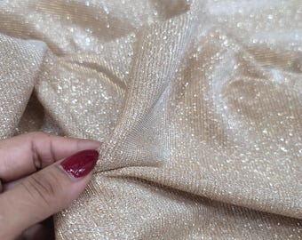 Tessuto in spandex con glitter oro champagne: tessuto elasticizzato in lurex per abiti
