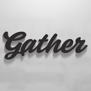 May include: Black wooden sign with the word "Gather" in a cursive font.