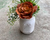 White ceramic mason jar style pot with faux succulent arrangement