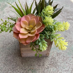 Faux succulent arrangement in wood box