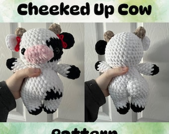 Może przedstawiać: Wzór na szydełku na biało-czarną krowę z czerwonymi kokardkami. Wzór nazywa się "Cheeked Up Cow".