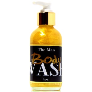 May include: A gold bottle with a pump dispenser. The label reads "The Man Body WASH 4 oz".