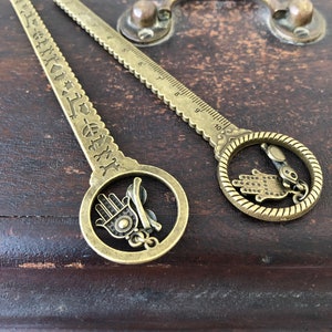 Circle top antique gold pd ruler with hanging glasses and hamsha hand
