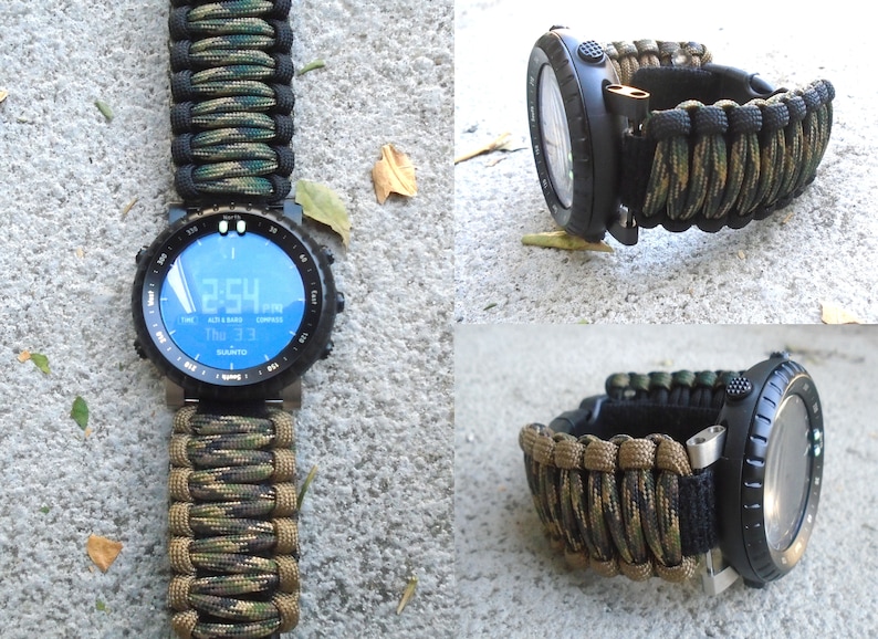 May include: A black digital watch with a green, black, and tan camouflage paracord strap. The watch face displays the time, date, and altitude.