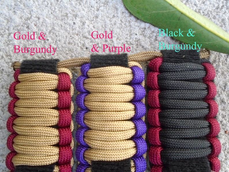 May include: Three paracord bracelets with different color combinations. The first bracelet is gold and burgundy, the second is gold and purple, and the third is black and burgundy.
