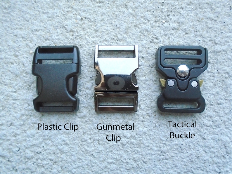 May include: Three different types of clips for attaching straps or webbing. The first is a black plastic clip, the second is a gunmetal clip, and the third is a black tactical buckle with a silver button.