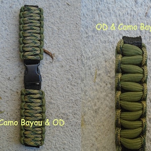 May include: Two paracord bracelets in green and black camouflage patterns. The bracelet on the left is labeled "Camo Bayou & OD". The bracelet on the right is labeled "OD & Camo Bayou".