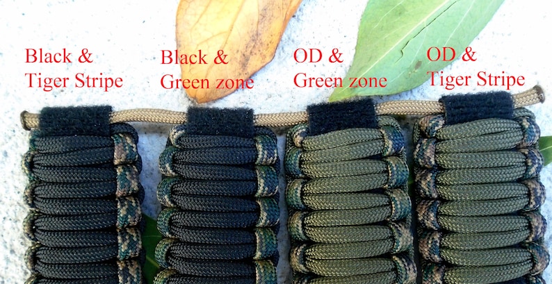 May include: Four paracord bracelets in different color combinations. The bracelets are made with black, green, and brown paracord. The bracelets are labeled "Black & Tiger Stripe", "Black & Green zone", "OD & Green zone", and "OD & Tiger Stripe".