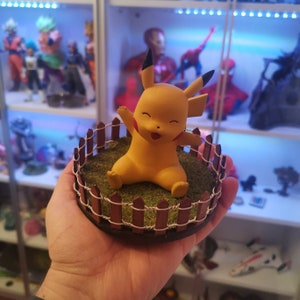 Hand-painted Pikachu figure with stand included