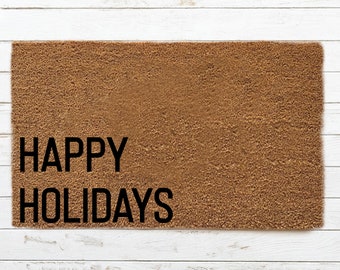 May include: A brown doormat with the text "HAPPY HOLIDAYS" in black lettering.