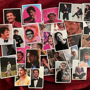 May include: A collage of images featuring a man with brown hair and a beard. The images are printed on white paper and have a white border. The images are arranged in a random pattern. Some of the images have text on them, such as "My Boyfriend" and "Pedro Pascal is my daddy".