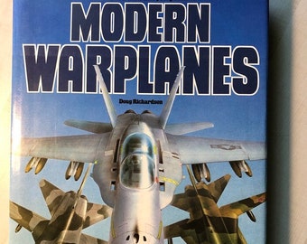 In Very Fine Condition; Oversized Hardcover; 1982 First English Edition, First Printing "The Illustrated Encyclopedia of Modern Warplanes"