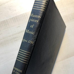 May include: Black hardcover book with gold lettering on the spine. The title is "Masterpieces of Music Before 1750". The author is Parrish & Ohl.