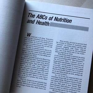 May include: A book page with the title "The ABCs of Nutrition and Health" and a section discussing the history of food and how it has changed over time. The text mentions the shift from natural, wholesome foods to processed and refined foods, and the impact this has had on health.