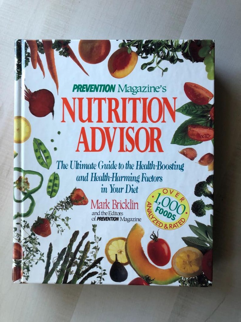 May include: A white book with a colorful cover featuring a variety of fruits and vegetables. The title is "Prevention Magazine's Nutrition Advisor: The Ultimate Guide to the Health-Boosting and Health-Harming Factors in Your Diet" by Mark Bricklin and the Editors of Prevention Magazine. The book cover also states "Over 1,000 Foods Analyzed & Rated".