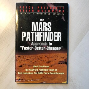 In Nearly Fine Overall Condition &quot; The Mark Pathfinder—Approach to Faster-Better-Cheaper—An Employee Handbook on Innovation&quot; Softcover Book