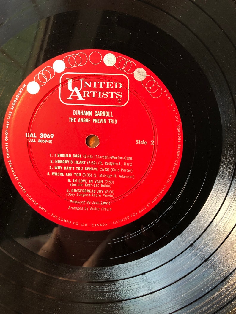 May include: A red vinyl record label with the title "United Artists" in white lettering. The record is by "Diahnne Carroll" and "The Andre Previn Trio". The record is "UAL 3069" and is side 2. The record includes the song titles "I Should Care", "Nobody's Heart", "Why Can't You Behave", "Where Are You", "In Love In Vain", and "Gingerbread Joy".