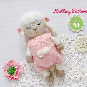 May include: Knitting pattern for a pink and white knitted lamb doll. The pattern is available in English and is a PDF download. ENG PDF.