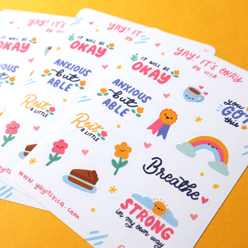 May include: A set of colorful stickers with positive affirmations and cute illustrations. The stickers feature phrases like "It will be okay", "Anxious but able", "Rest a little", "You got this", "Breathe", and "Strong in my own way".