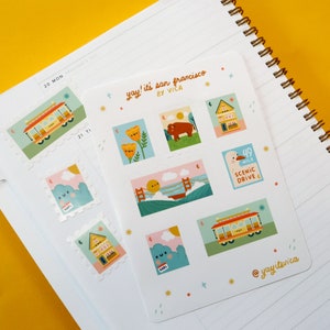 May include: A set of nine colorful stickers featuring illustrations of San Francisco landmarks, including a cable car, a seagull, a house, and a flower. The stickers are printed on white paper and have a glossy finish. The text "yay! it's san francisco by VICA" is printed at the top of the sheet.