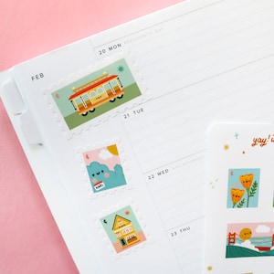 May include: A set of colorful stickers featuring illustrations of a cable car, a cloud with a face, a house, a flower, and a bridge. The stickers are designed to look like postage stamps with a scalloped edge.