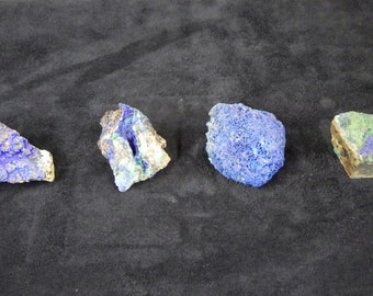 May include: Four rough, irregular shaped pieces of blue and green azurite and malachite mineral specimens.