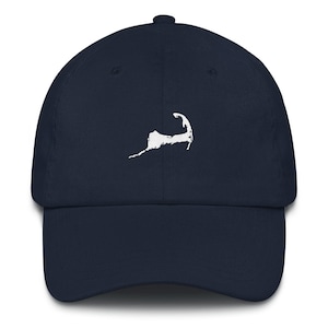 May include: A navy blue baseball cap with a white embroidered outline of Cape Cod.