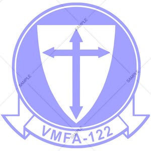 May include: A purple circle with a white shield inside. The shield has a white cross with arrows pointing in each direction. The text "VMFA-122" is written in white below the shield.