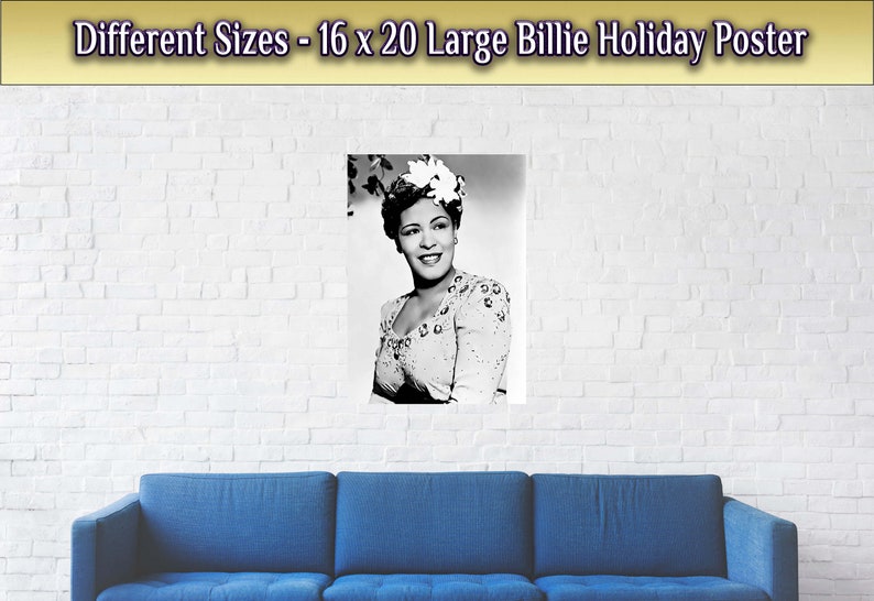 May include: Black and white photo of Billie Holiday, a famous jazz singer, wearing a white flower in her hair. The photo is printed on a poster with a white brick wall background.