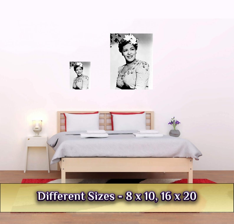 May include: Black and white photo print of a woman wearing a flower in her hair. The photo is framed and hanging on a white wall above a bed with white bedding. The text "Different Sizes - 8 x 10, 16 x 20" is displayed below the image.