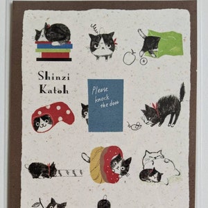 May include: A postcard featuring illustrations of black and white cats in various poses. The postcard has a brown border and a white background with black text that reads "Shinzi Katoh" and "Please knock the door".