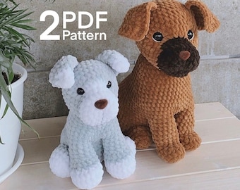May include: Two crocheted stuffed dog toys. One is brown and the other is light blue with white accents. The text "2 PDF Pattern" is visible in the image.