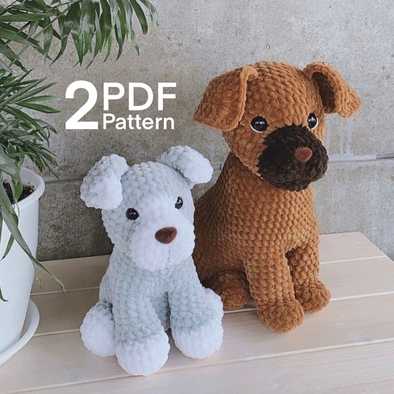 May include: Two crocheted stuffed dog toys. One is brown and the other is light blue with white accents. The text "2 PDF Pattern" is visible in the image.