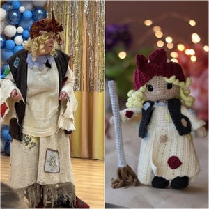 May include: A woman dressed as a witch with a red and white headscarf and a long white dress with patches. She is holding a broom. A crocheted doll dressed as a witch with a red hat and a long white dress with patches is standing next to her.