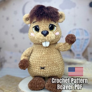 May include: Crochet pattern for a brown beaver amigurumi toy. The pattern is available as a PDF download. The pattern includes instructions for crocheting the beaver's body, head, ears, and tail. The pattern also includes instructions for adding details such as eyes, nose, and teeth.