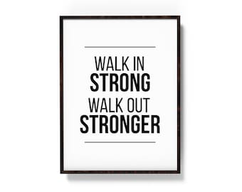 May include: Black and white motivational quote in a brown frame. The quote reads "Walk in strong, walk out stronger."
