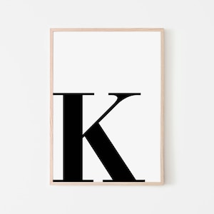 May include: A black and white printable poster featuring the letter K in a bold, sans-serif font.