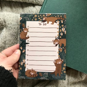 May include: A green to-do list notepad with a floral border and red panda illustrations. The notepad says "To Do" at the top.