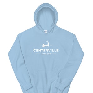 May include: Light blue hooded sweatshirt with a white graphic of the outline of Cape Cod and the text "INC. 1859 CENTERVILLE CAPE COD".