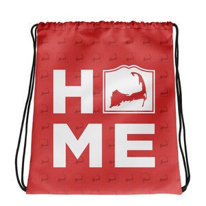 May include: Red drawstring bag with a white "HOME" graphic featuring the outline of Cape Cod. The bag is covered in a repeating pattern of the Cape Cod outline.