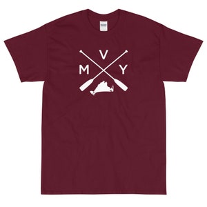 May include: Burgundy short-sleeved t-shirt with a white graphic of a crossed pair of oars with the letters "V" and "Y" on the oars and the letters "M" and "Y" on the handles. The graphic also includes the outline of the state of Virginia.