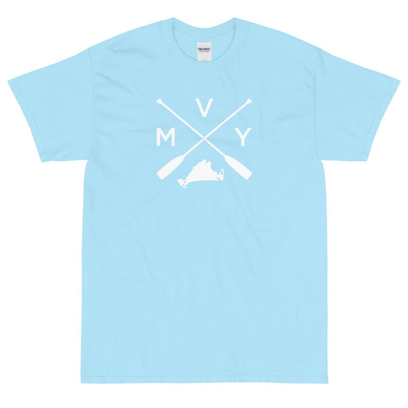 May include: A light blue t-shirt with a white graphic design. The graphic features a stylized outline of the state of Virginia with two crossed oars and the letters "M V Y" above the state.