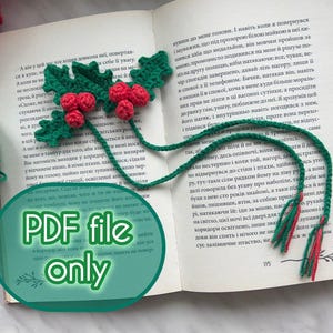 May include: A handmade green and red crochet holly leaf and berry bookmark. The bookmark is placed on an open book with text. The image also includes a ball of green yarn and the text "PDF file only".