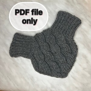 May include: Gray knitted neck warmer with a cable knit pattern. PDF file only.