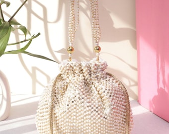 Potli Bag- Off White Beads, Sequins, Tassels, Pearls And Embellished Potli Bag