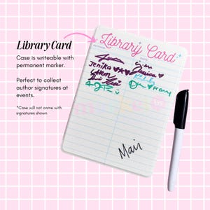 a library card with a black pen and a pink background.